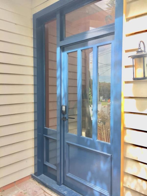 Wooden door with blue paint finish
